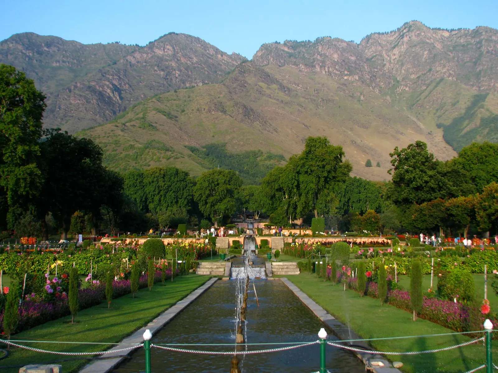 Terraced lawns, flowerbeds and central water channel of Nishat Bagh Mughal garden beneath the Zabarwan mountains, Srinagar