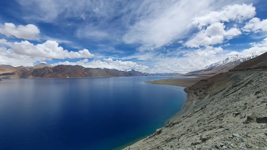 The deep blue waters of Pangong Tso curving between the barren mountains of eastern Ladakh